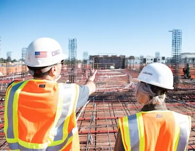 Workers reviewing a construction site